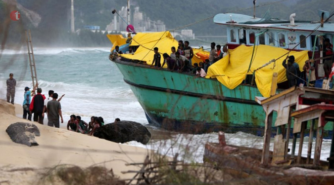 Migrants in Indonesia boat stand-off brought ashore