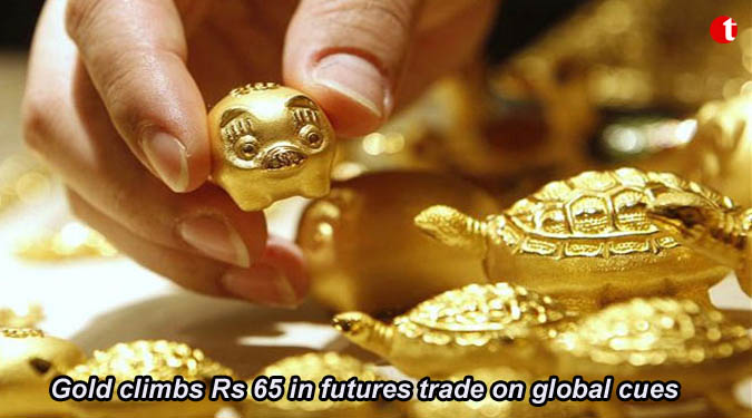 Gold climbs Rs 65 in futures trade on global cues