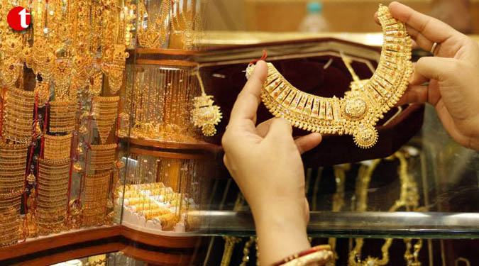 Gold futures climb Rs 77 on global cues