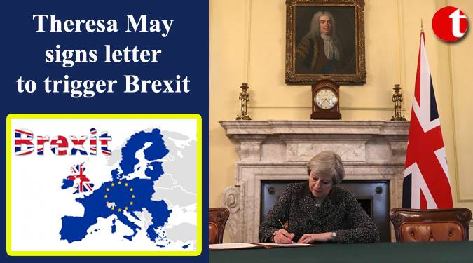 Theresa May signs letter to trigger Brexit