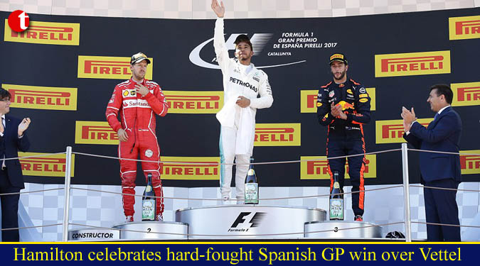 Hamilton celebrates hard-fought Spanish GP win over Vettel