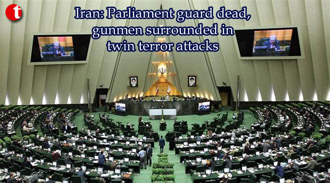 Iran: Parliament guard dead, gunmen surrounded in twin terror attacks