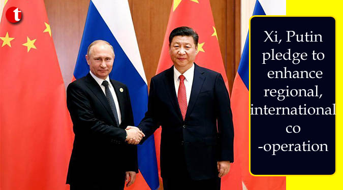 Xi, Putin pledge to enhance regional, international cooperation