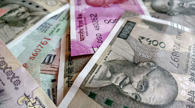 Rupee recovers from record lows, up 9 paise against US dollar