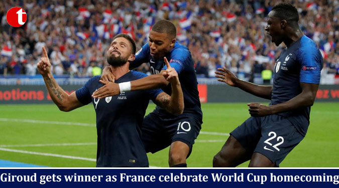 Giroud gets winner as France celebrate World Cup homecoming