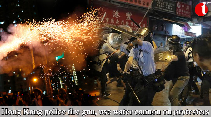 Hong Kong police fire gun, use water cannon on protesters