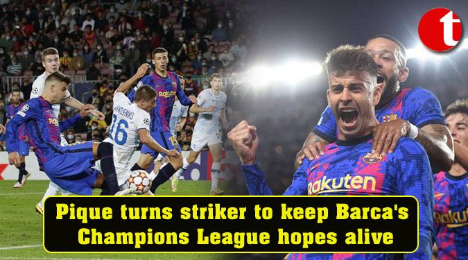 Pique turns striker to keep Barca’s Champions League hopes alive