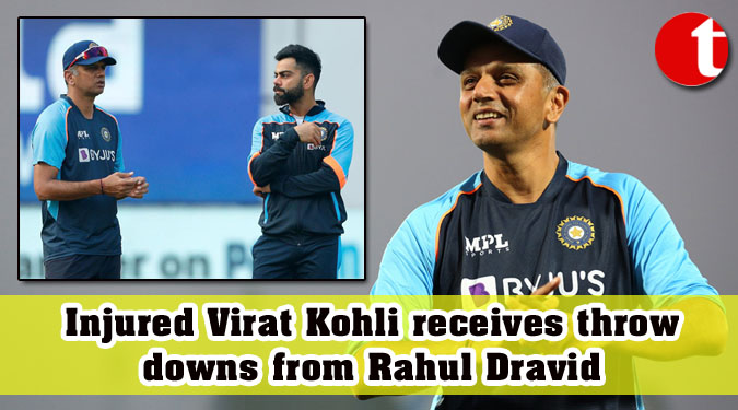 Injured Virat Kohli receives throwdowns from Rahul Dravid