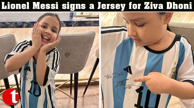 Lionel Messi signs a Jersey for Ziva Dhoni